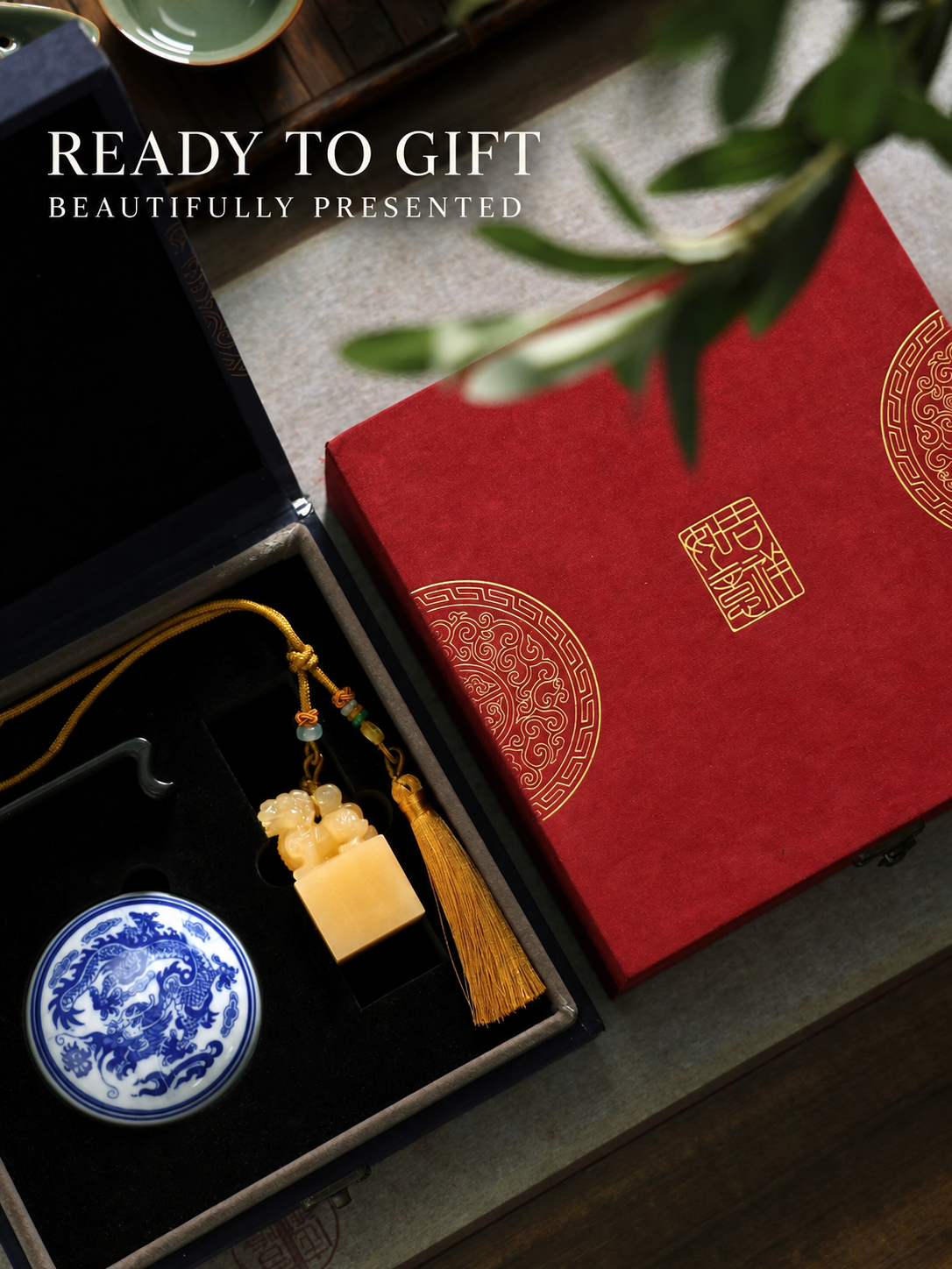 Personalized Qilin seal presented with red and blue gift boxes